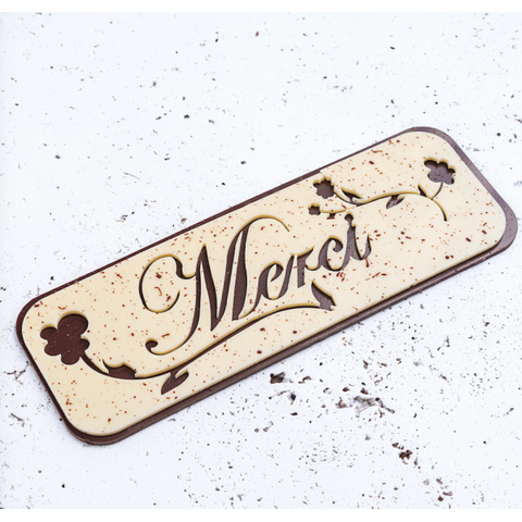 La plaquette Merci cut